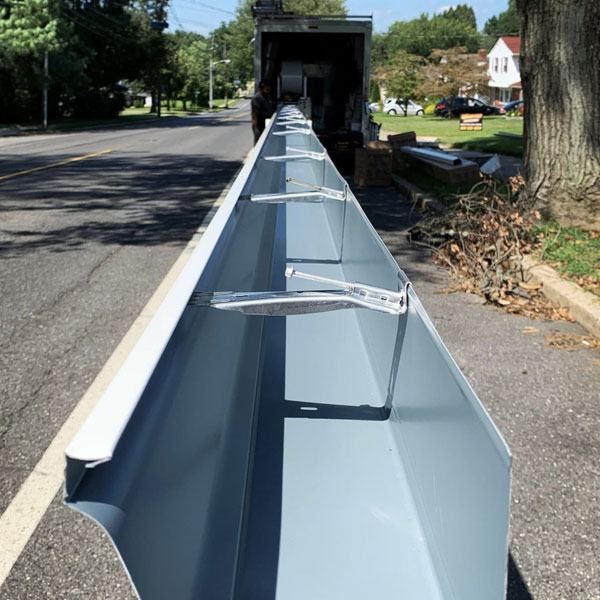 Seamless gutter and downspout installation on a New Jersey home by Warner Exteriors & Solar.